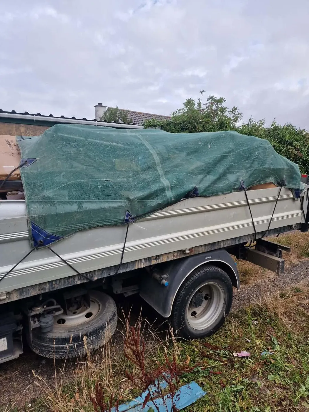 Empire tipper truck loaded and netted after a clearance
